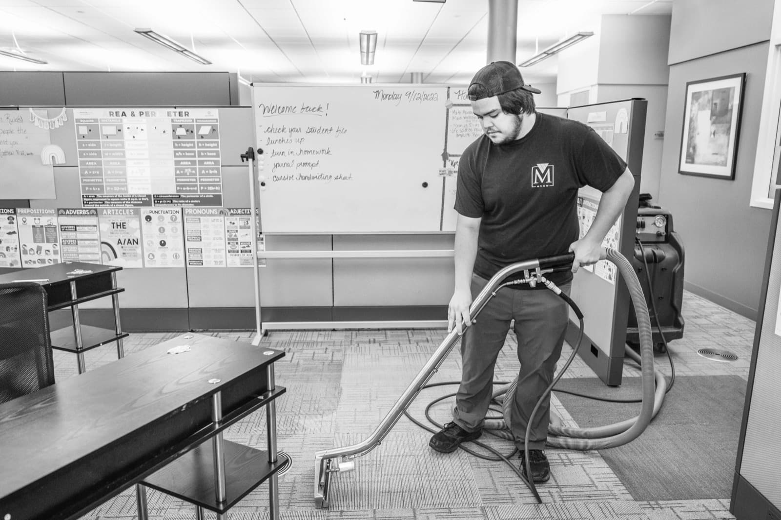 An MSNW crew member deep-cleaning office carpet after hours